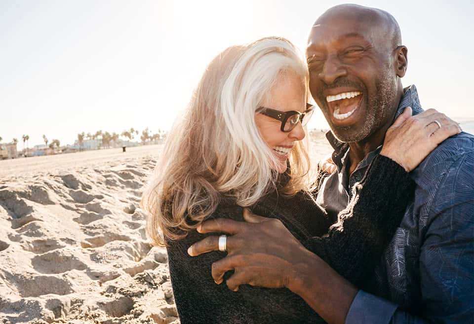 Couple on the beach enjoying their retirement
