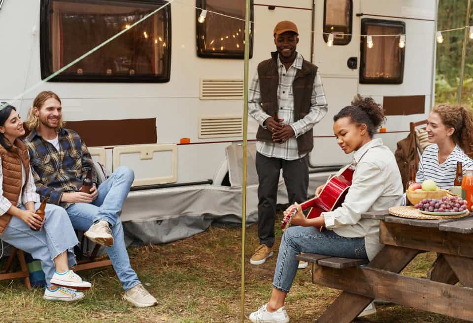 Family spending time outside of RV