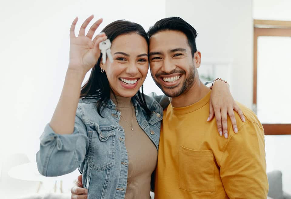 New homeowners with keys in hand