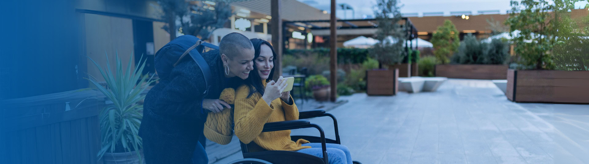 Couple with disabled person taking a selfie