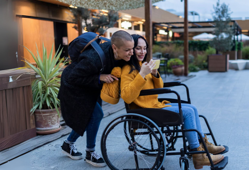 Couple with disabled person taking a selfie