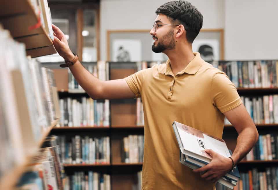 Students looking for books in the library