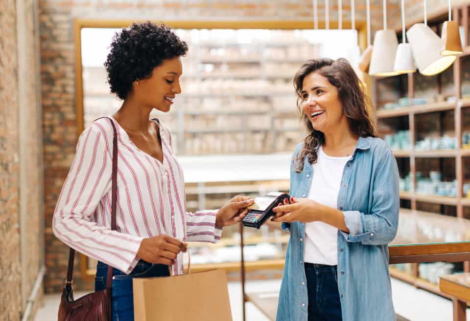 woman paying with mobile wallet