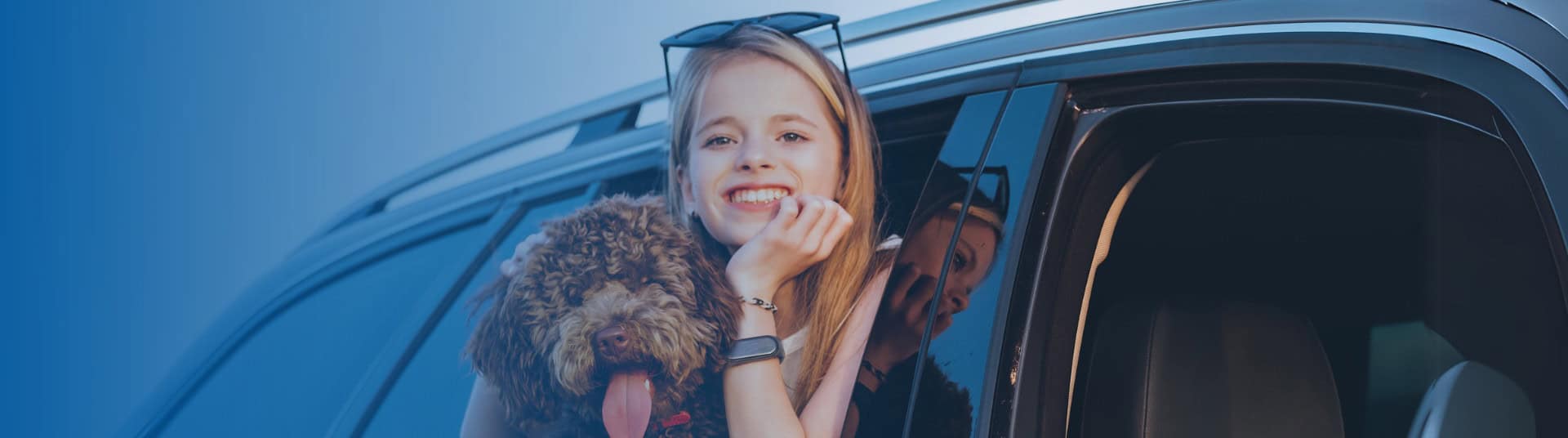 Girl with dog Hanging out the window
