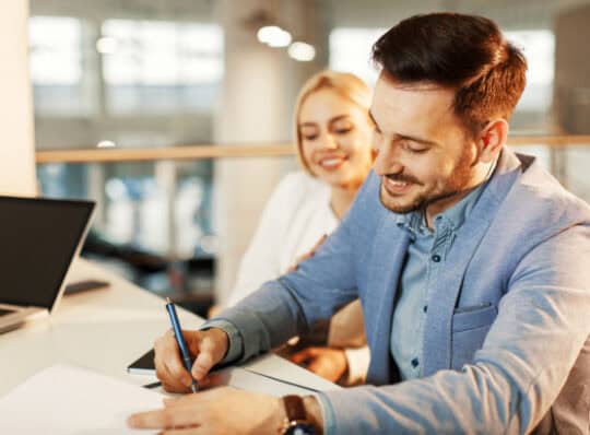Couple signing a personal loan