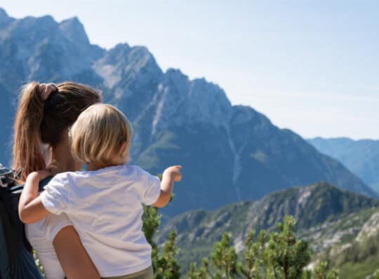 Mother and child looking at the mountains