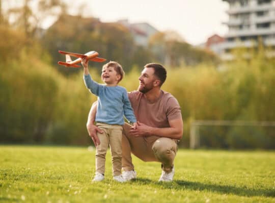 Father and son playing in the park