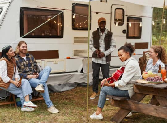 Family spending time outside of RV