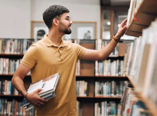 Students looking for books in the library
