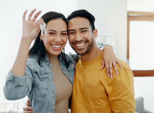 New homeowners with keys in hand