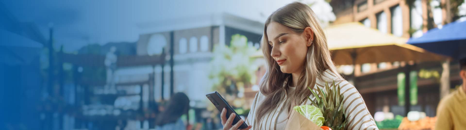 woman paying with zelle at a farmers market