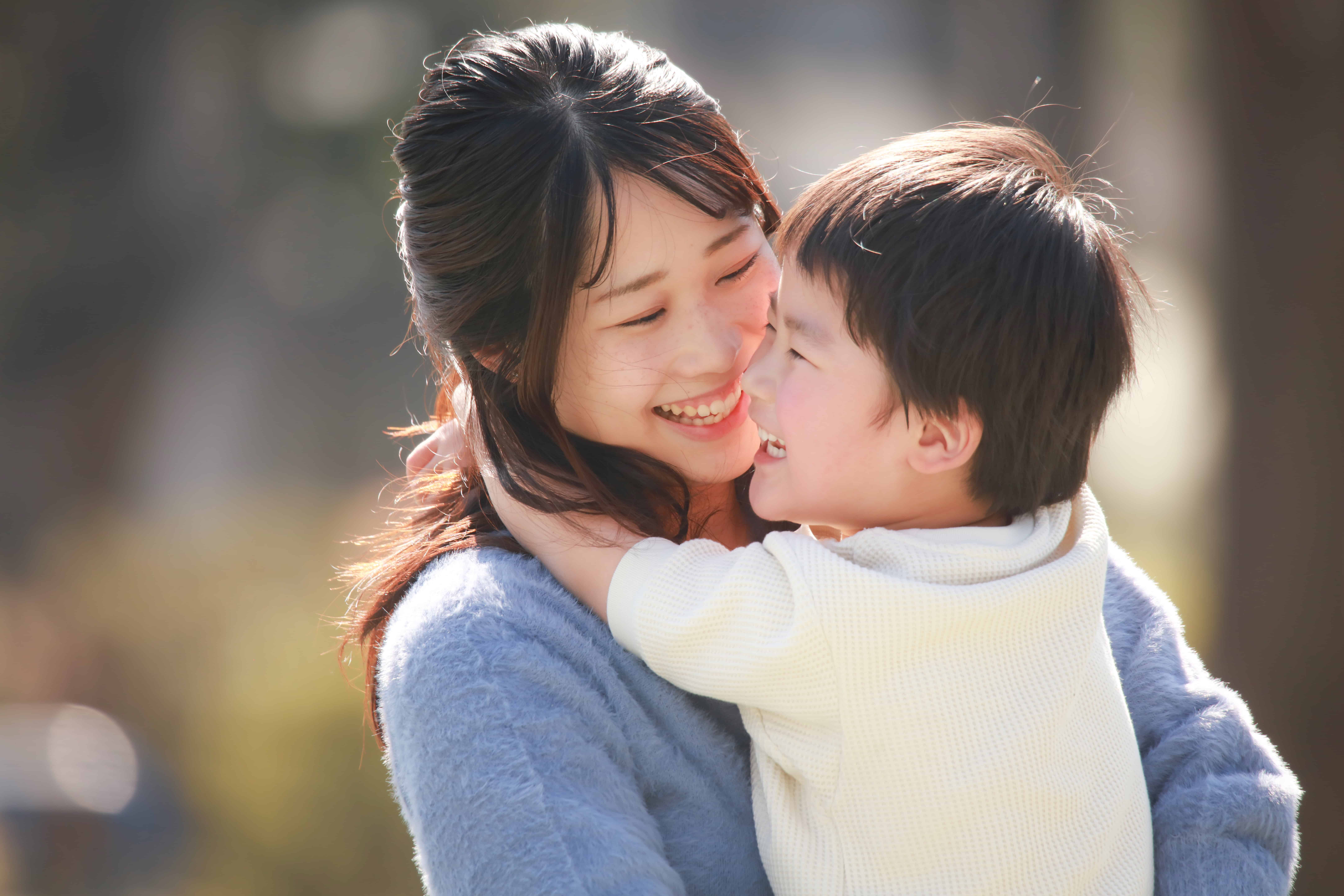 Mom and son hugging
