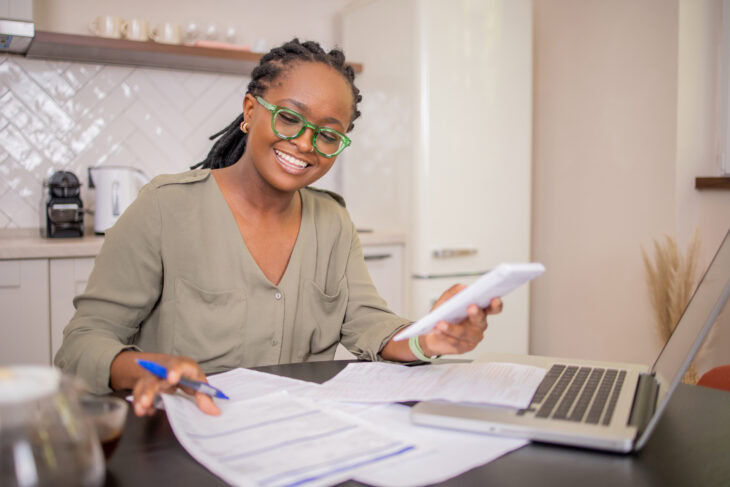 Young woman calculating her retirement goals