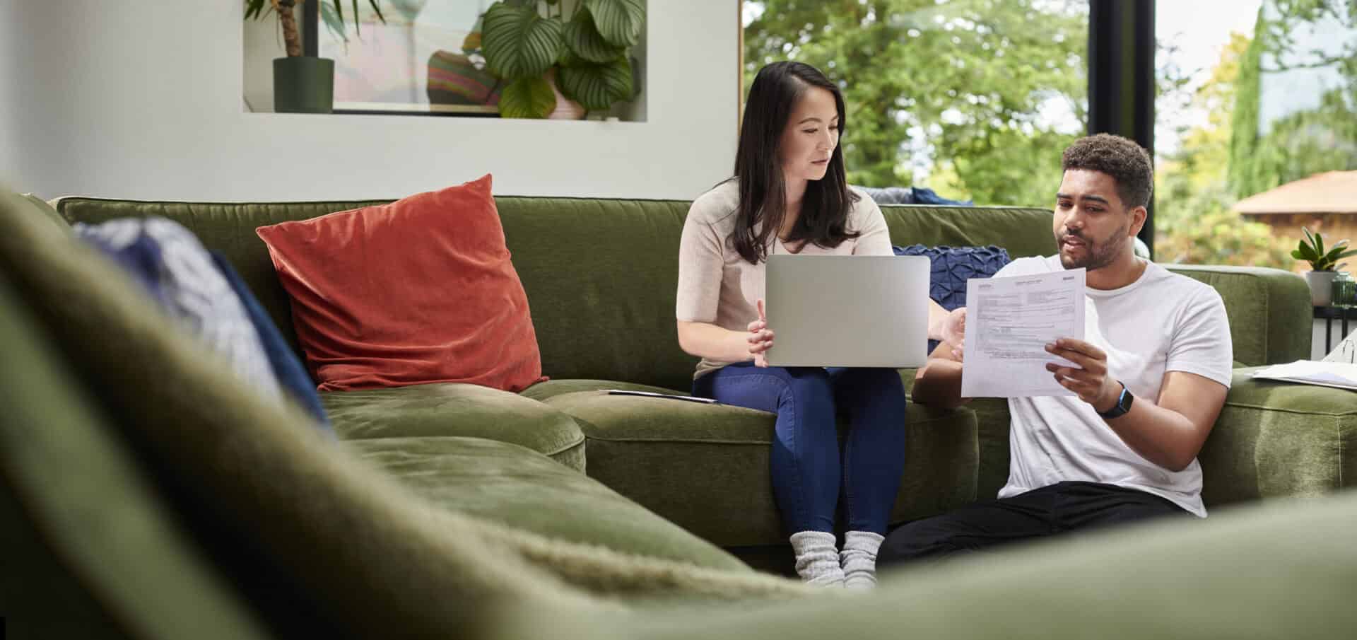 Couple planning their finances on the couch